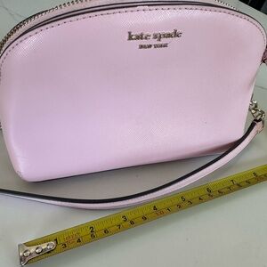 kate spade light pink crossbody bag with gold logo